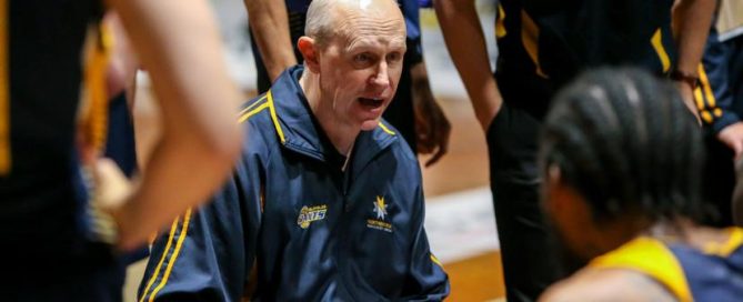 Coach Wayne Creek speaks to his players during round 20 of the N