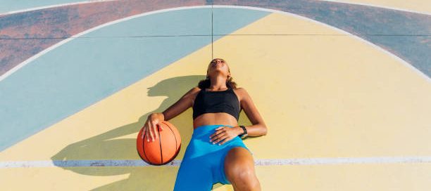 Basketball Athlete Sleeping on the Court.